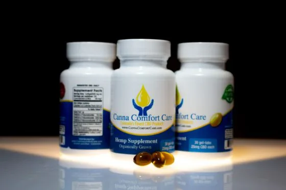 Canna Comfort Care hemp supplement bottle and gel tabs, product photo by Jeremy Benisek.